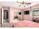 Bedroom with a ceiling fan, a large mirror, neutral carpet and good lighting at 5145 W Odeum Ln, Phoenix, AZ 85043