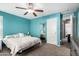 Bedroom featuring ceiling fan, neutral carpet and good lighting at 5145 W Odeum Ln, Phoenix, AZ 85043