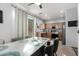 Dining area adjacent to kitchen, showcasing a modern table and seating for six at 5145 W Odeum Ln, Phoenix, AZ 85043
