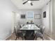 Dining area featuring a modern table, six chairs, and neutral finishes at 5145 W Odeum Ln, Phoenix, AZ 85043