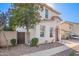 View of home's front yard with walkway and privacy gate, adding to the property's appeal at 5145 W Odeum Ln, Phoenix, AZ 85043