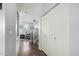 Entry hall with neutral tones, hardwood floors, and stairs leading to the bright and airy living room area at 5145 W Odeum Ln, Phoenix, AZ 85043