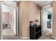 Neutral hallway with fresh flowers, views of the bedrooms, and plush carpet that adds warmth and comfort to the home at 5145 W Odeum Ln, Phoenix, AZ 85043