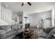 Open-concept living room with stylish decor, neutral paint, and staircase access at 5145 W Odeum Ln, Phoenix, AZ 85043