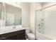 The bathroom features a vanity with storage and a shower-tub combo at 5721 W Getty Dr, Phoenix, AZ 85043