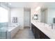 Bright bathroom with a luxurious soaking tub, walk-in shower, and a dual sink vanity at 632 W Springfield Pl, Chandler, AZ 85286
