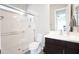 Clean and modern bathroom with a walk-in shower, white toilet, and dark wood vanity at 632 W Springfield Pl, Chandler, AZ 85286