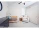 Charming Bedroom with a crib, comfortable chair, and ample closet space at 632 W Springfield Pl, Chandler, AZ 85286