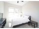 Simple bedroom with neutral carpet, a modern platform bed, and natural light from a window at 632 W Springfield Pl, Chandler, AZ 85286