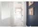 Bright hallway with neutral walls, plush carpeting, and artful wall decor at 632 W Springfield Pl, Chandler, AZ 85286