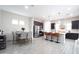 Open concept kitchen and dining area with stainless steel appliances and modern design at 632 W Springfield Pl, Chandler, AZ 85286