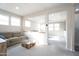 Comfortable living room space with abundant natural light and plush neutral carpeting at 632 W Springfield Pl, Chandler, AZ 85286