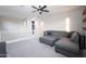 Cozy upstairs living room with a gray sectional sofa and views of the staircase at 632 W Springfield Pl, Chandler, AZ 85286