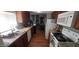 Well-lit kitchen with stainless steel appliances, granite countertops, and wood cabinets at 6943 W Devonshire Ave # 1355, Phoenix, AZ 85033