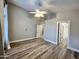 This bedroom includes wood floors, light walls, and doorways leading to other rooms at 723 E Whitten St, Chandler, AZ 85225