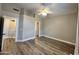 The bedroom has wood floors, light walls, and doorways leading to other rooms at 723 E Whitten St, Chandler, AZ 85225