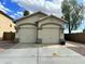 Inviting single-story home featuring a two-car garage and neutral stucco exterior at 723 E Whitten St, Chandler, AZ 85225