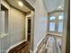 This hallway has wood floors, white trim, and neutral colored walls at 723 E Whitten St, Chandler, AZ 85225