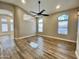 Open-concept living room with stylish flooring, neutral walls, and natural light at 723 E Whitten St, Chandler, AZ 85225
