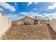 Spacious backyard of home with a block wall fence and a covered patio, ready for landscaping at 824 N Williams Cir, Mesa, AZ 85203