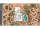An aerial view of a sprawling property featuring a private pool and lush desert landscaping at 8540 E Mcdowell Rd # 125, Mesa, AZ 85207