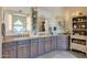 Bathroom featuring custom wood cabinetry, granite counters, and stylish decor at 8540 E Mcdowell Rd # 125, Mesa, AZ 85207