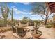 Inviting outdoor courtyard with a fountain, fire pit, and comfortable seating, perfect for relaxing at 8540 E Mcdowell Rd # 125, Mesa, AZ 85207