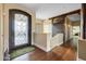 Inviting foyer featuring a custom iron door, wood floors, and a sliding barn door at 8540 E Mcdowell Rd # 125, Mesa, AZ 85207