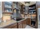 Modern kitchen featuring stainless steel appliances, elegant cabinetry, and tile backsplash, creating a luxurious cooking space at 8540 E Mcdowell Rd # 125, Mesa, AZ 85207
