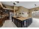 Expansive kitchen island with granite countertop, dual sinks, and custom cabinetry in a spacious, well-lit room at 8540 E Mcdowell Rd # 125, Mesa, AZ 85207