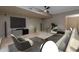 Inviting living room featuring a large television, plush seating, and stylish decor for relaxation at 8540 E Mcdowell Rd # 125, Mesa, AZ 85207