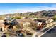 Aerial view of a residential neighborhood with well-maintained homes and mountain views at 9013 S 15Th Way, Phoenix, AZ 85042
