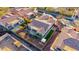 Aerial view of a well-kept backyard with mature trees, pavers, artificial turf, and barbecue at 9013 S 15Th Way, Phoenix, AZ 85042