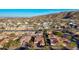 Expansive aerial view showing a vibrant community with a mix of home styles and picturesque mountain views at 9013 S 15Th Way, Phoenix, AZ 85042