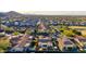 Community aerial view with neatly arranged homes, tile roofs, desert landscape, and mountain views at 9013 S 15Th Way, Phoenix, AZ 85042