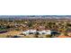 Panoramic aerial view of suburban homes with modern architecture against a breathtaking cityscape backdrop at 9013 S 15Th Way, Phoenix, AZ 85042