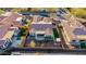 Aerial view of a well-manicured backyard with artificial grass, a bar-b-q, and a desert landscape at 9013 S 15Th Way, Phoenix, AZ 85042