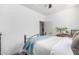 This bedroom features a stylish bed frame, modern decor, and bright natural lighting at 9013 S 15Th Way, Phoenix, AZ 85042