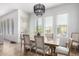 Dining area filled with natural light from windows, features wood table and seating for six at 9013 S 15Th Way, Phoenix, AZ 85042
