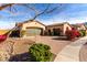 Charming single-story home featuring a brick driveway, two-car garage, and well-maintained landscaping at 9013 S 15Th Way, Phoenix, AZ 85042