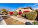 Charming single Gathering home featuring vibrant landscaping, sidewalk, terracotta roofing, and front lawn at 9013 S 15Th Way, Phoenix, AZ 85042
