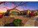 Charming single-story home with a brick driveway, desert landscaping, and a two-car garage at 9013 S 15Th Way, Phoenix, AZ 85042