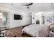 This main bedroom boasts a spacious layout, wooden floors, and a modern ceiling fan at 9013 S 15Th Way, Phoenix, AZ 85042