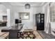 Stylish home office featuring a dark wood desk, modern decor, and a patterned area rug at 9013 S 15Th Way, Phoenix, AZ 85042