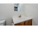 Bathroom vanity showcasing a sink, framed mirror, and wood-grain cabinet at 10432 N 7Th Pl # 1, Phoenix, AZ 85020