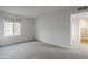Bright bedroom featuring a large window and neutral carpet, creating a serene and comfortable space at 10432 N 7Th Pl # 1, Phoenix, AZ 85020