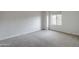 Bright bedroom with plush carpeting and a sunlit window offering serene views at 10432 N 7Th Pl # 1, Phoenix, AZ 85020