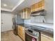 Well-equipped kitchen with stainless steel appliances and abundant cabinet storage at 10432 N 7Th Pl # 1, Phoenix, AZ 85020