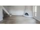 Spacious living area featuring a decorative fireplace and staircase, freshly painted at 10432 N 7Th Pl # 1, Phoenix, AZ 85020