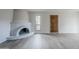 Bright living room with a unique vintage-style fireplace and new floors at 10432 N 7Th Pl # 1, Phoenix, AZ 85020